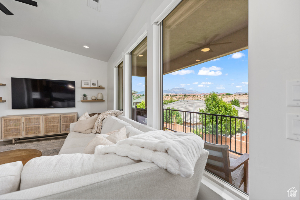 Bedroom featuring access to exterior, lofted ceiling, ceiling fan, wood finished floors, and recessed lighting