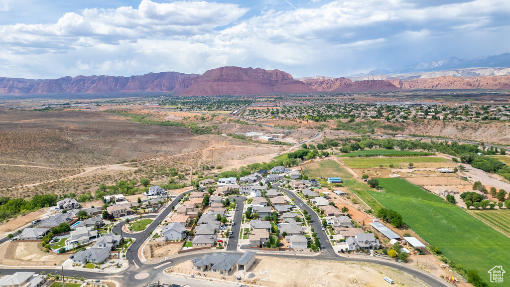 View of property location with a mountainous background and nearby suburban area