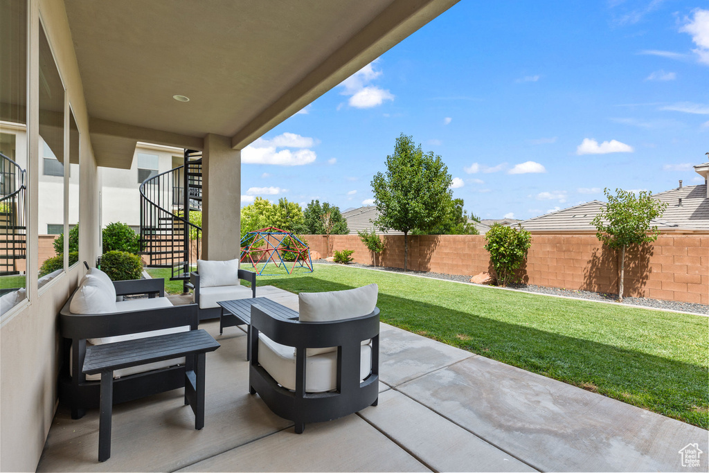 View of patio / terrace with stairs, an outdoor living space, and a playground