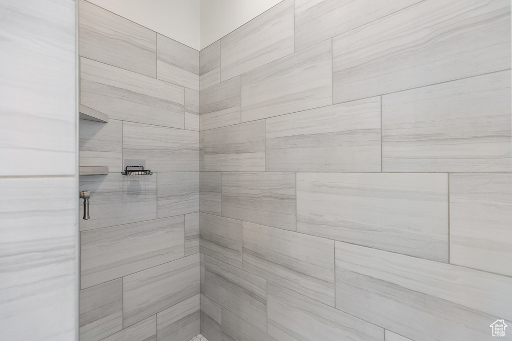 Bathroom featuring tiled shower