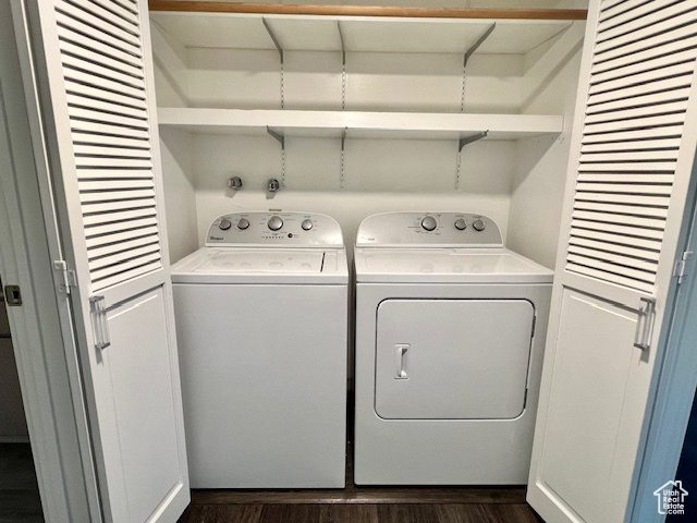Laundry room featuring dark wood finished floors and washing machine and dryer