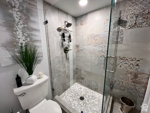 Bathroom with toilet and a stall shower
