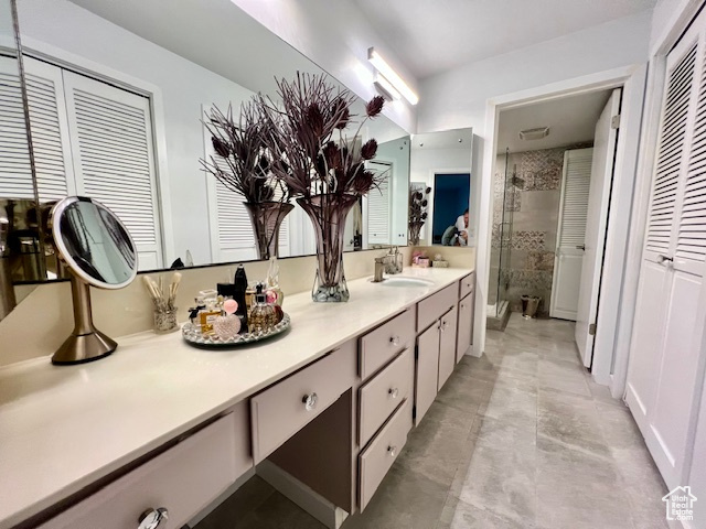 Bathroom with a shower stall and double vanity