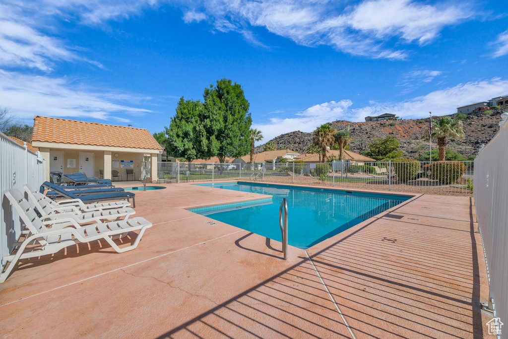 Community pool featuring a patio area and a mountain view