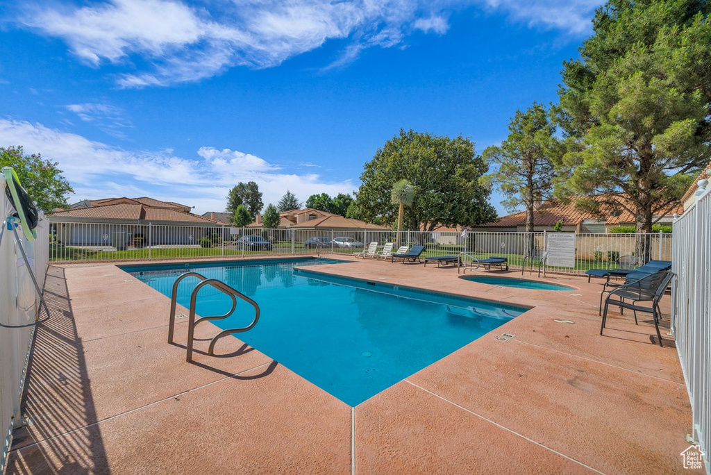 Community pool featuring a patio area