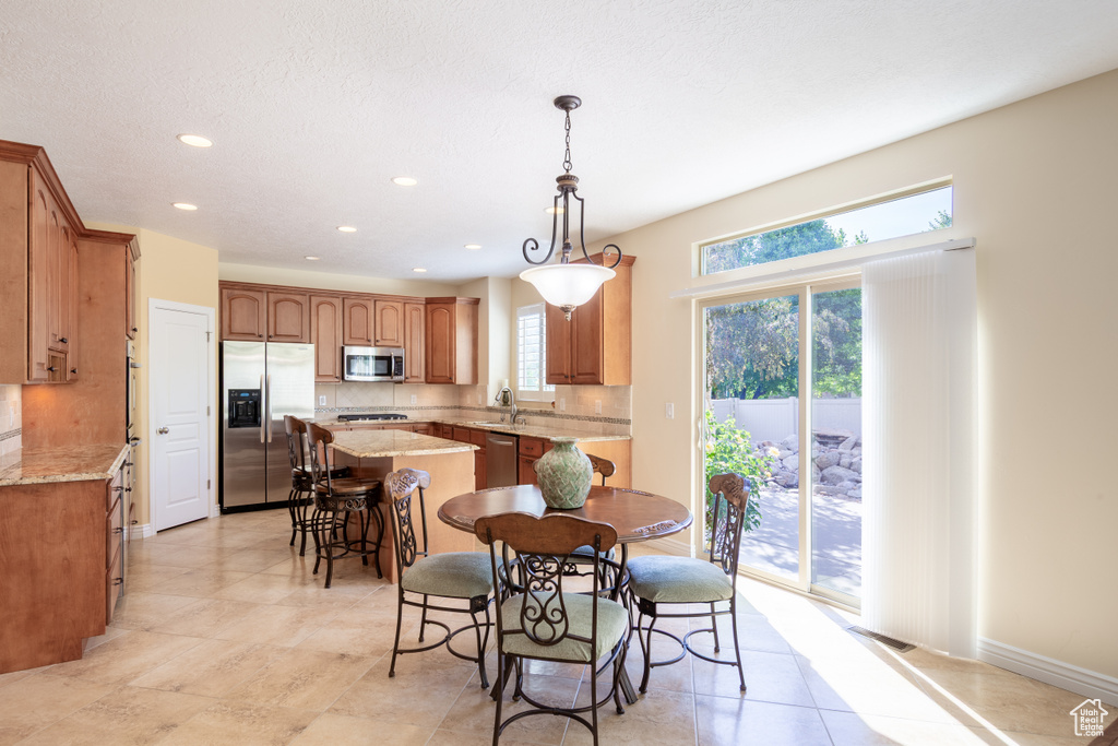 Dining room featuring recessed lighting and baseboards