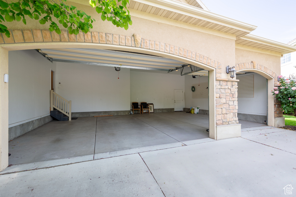 Garage featuring driveway