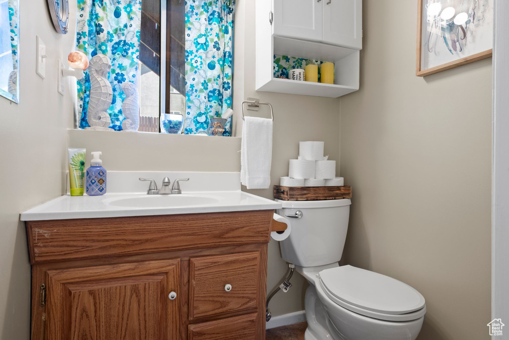 Bathroom with toilet and vanity
