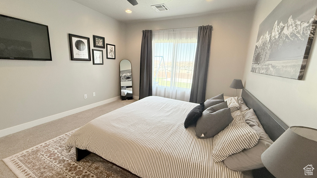 Bedroom featuring carpet flooring, baseboards, and recessed lighting