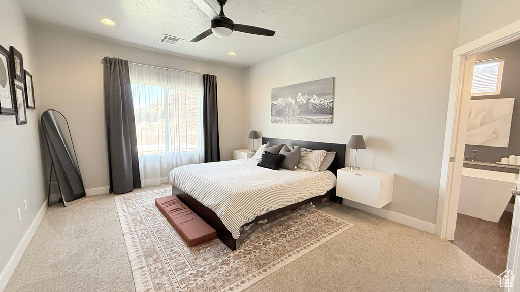 Bedroom with carpet floors, multiple windows, baseboards, ceiling fan, and recessed lighting