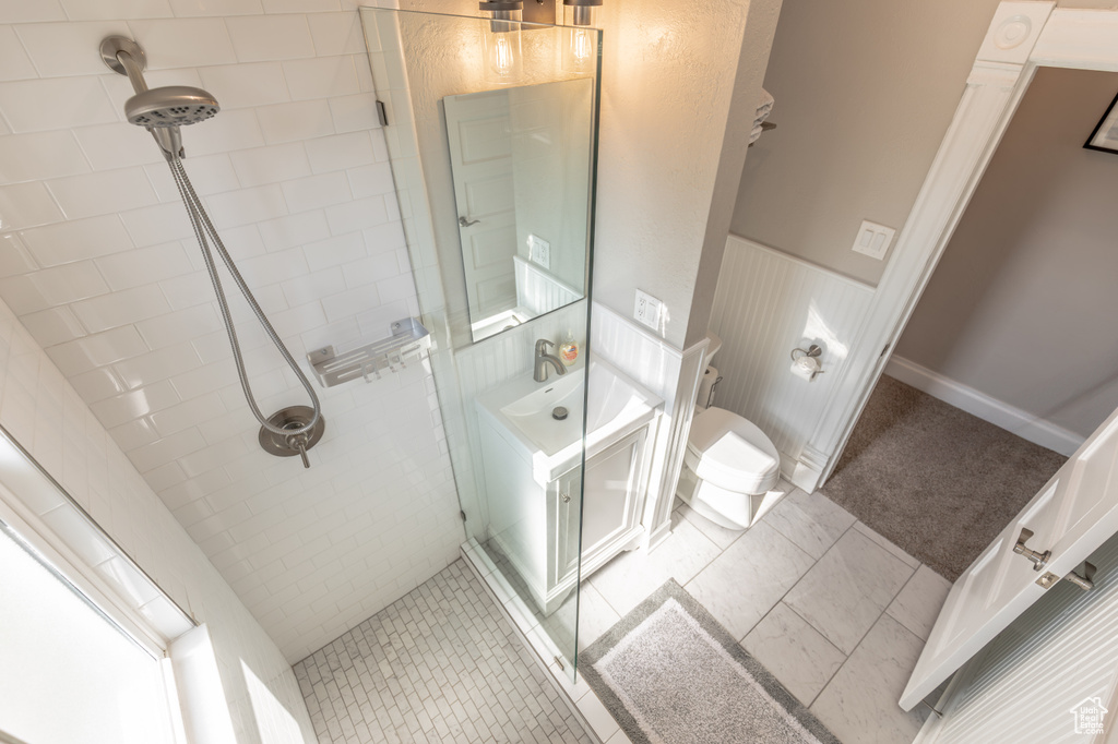 Bathroom with tiled shower and toilet