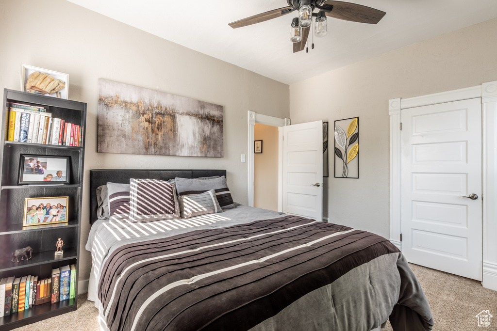 Bedroom with carpet flooring and a ceiling fan