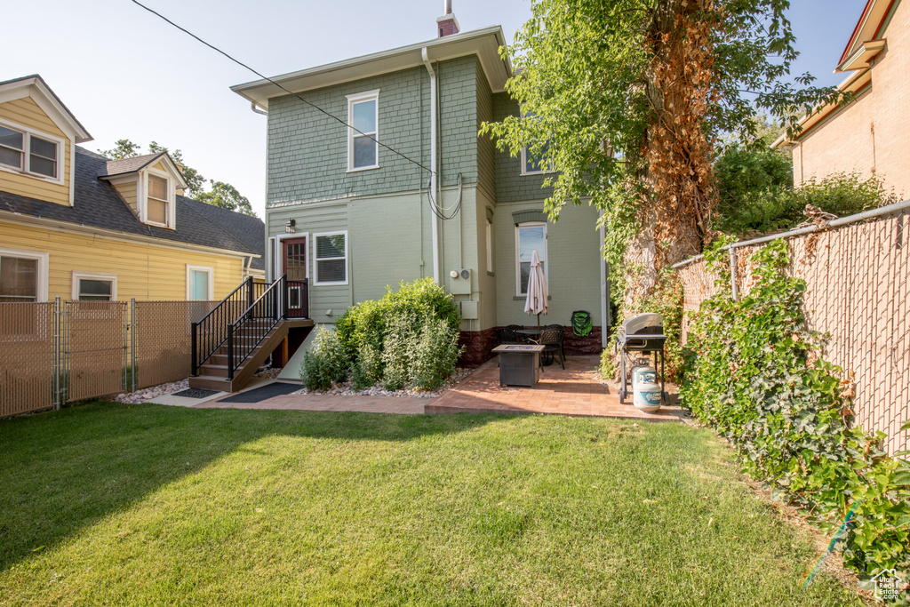 Back of property featuring a patio area