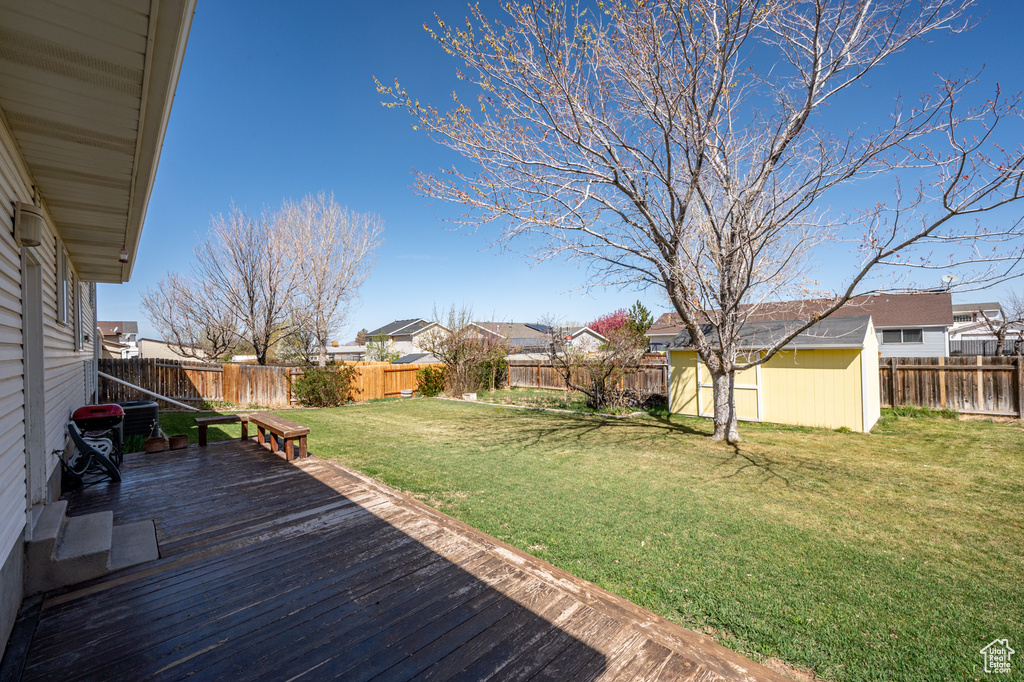 Wooden terrace featuring a residential view
