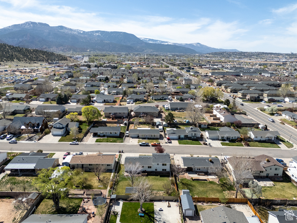 Aerial perspective of suburban area featuring a mountainous background