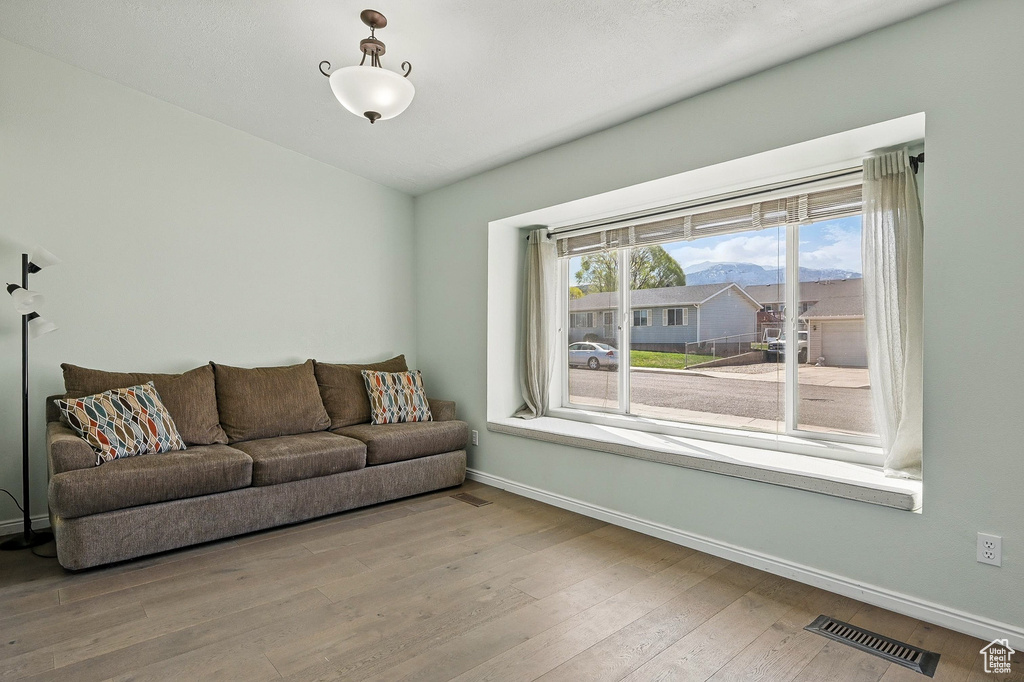 Living room with baseboards and wood finished floors