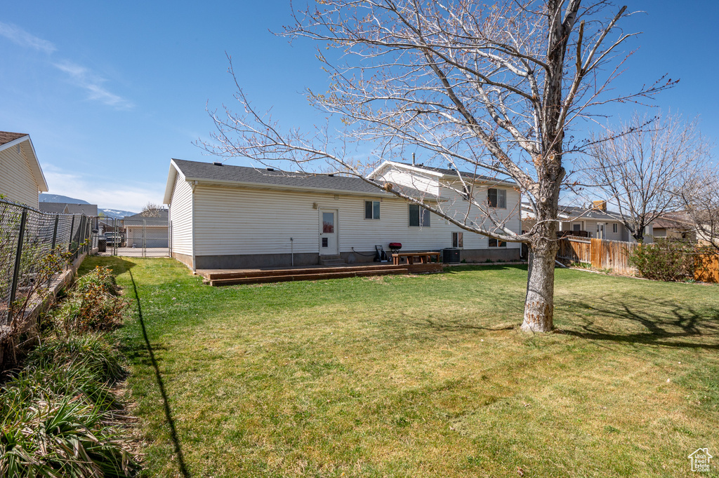 Back of property featuring a deck