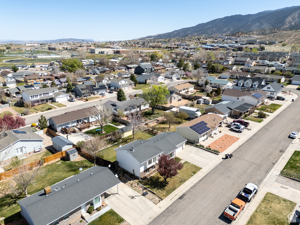 Aerial perspective of suburban area with a mountainous background