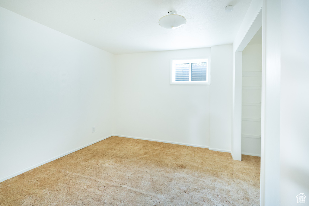 Unfurnished room featuring carpet floors and baseboards