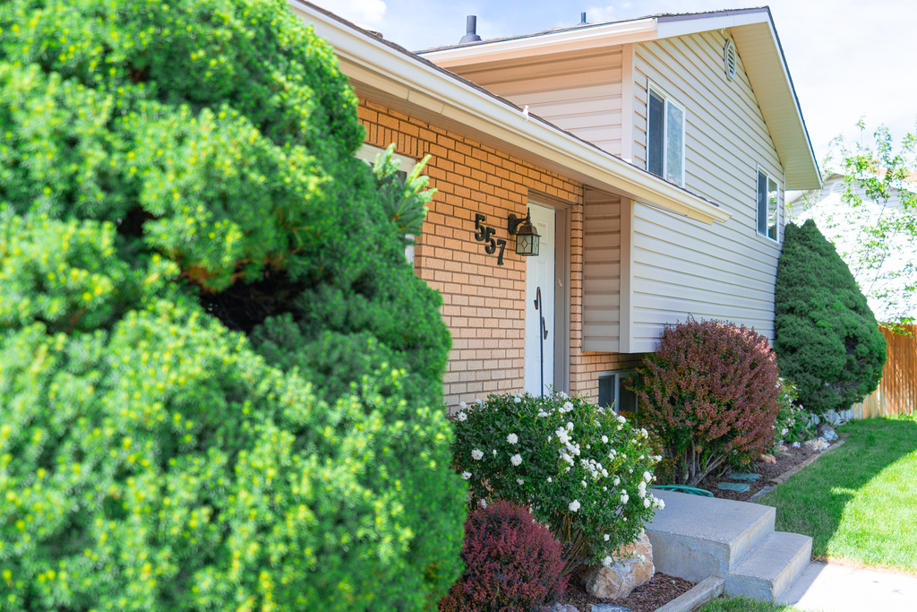 Property entrance featuring brick siding