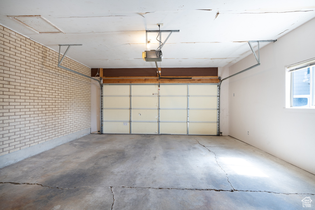 Garage featuring a garage door opener