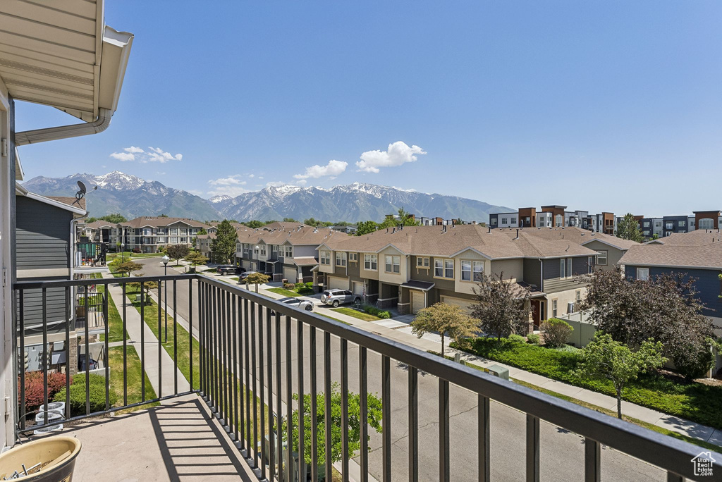 Balcony with a residential view and a mountain view