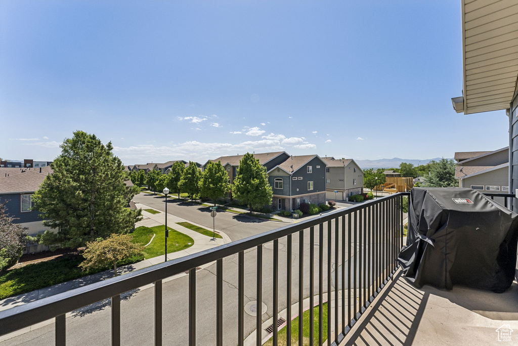 Balcony with a residential view and a grill