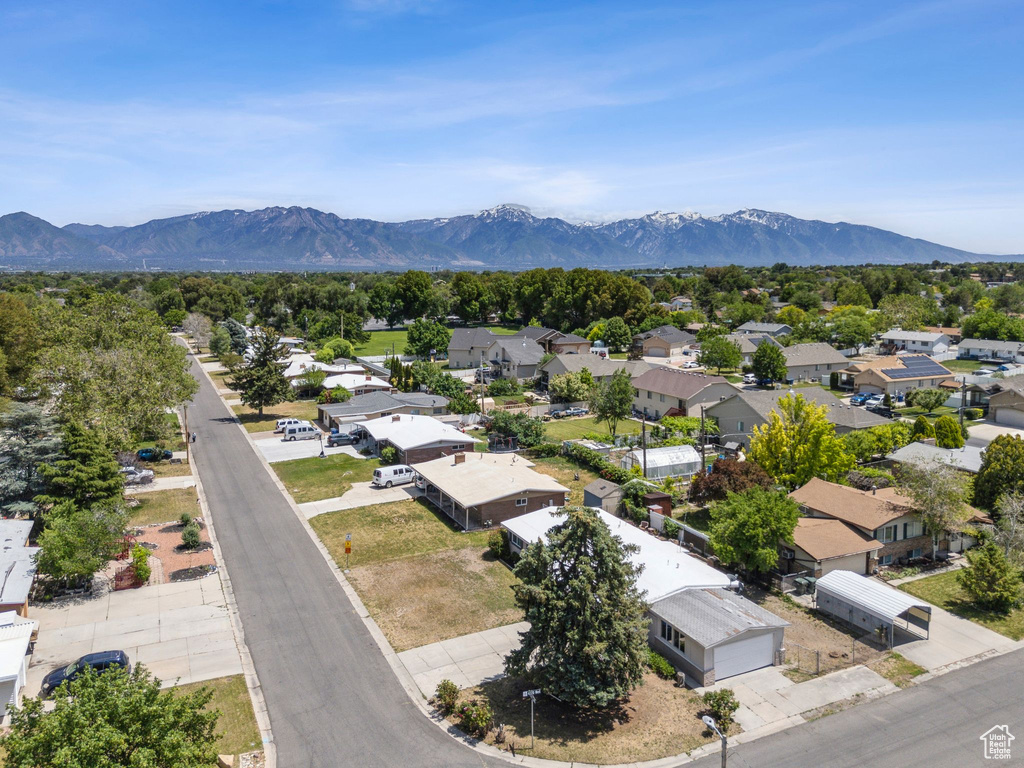 Aerial view of residential area featuring a mountainous background