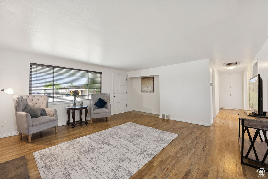 Living area with light wood-type flooring and baseboards