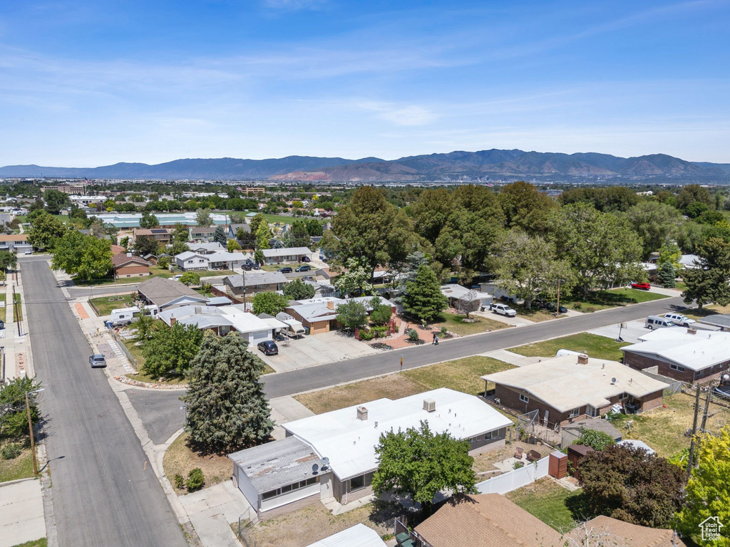 Aerial perspective of suburban area with a mountainous background