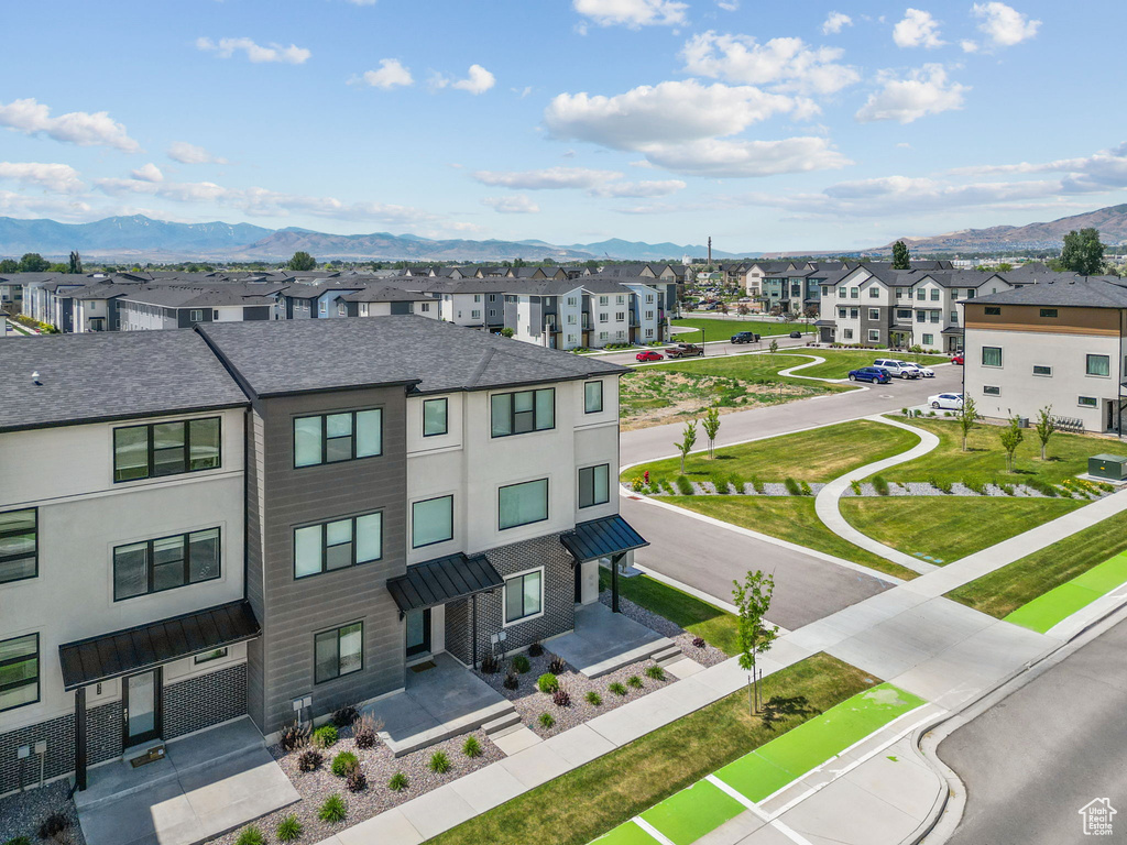 Aerial view of residential area featuring a mountain backdrop