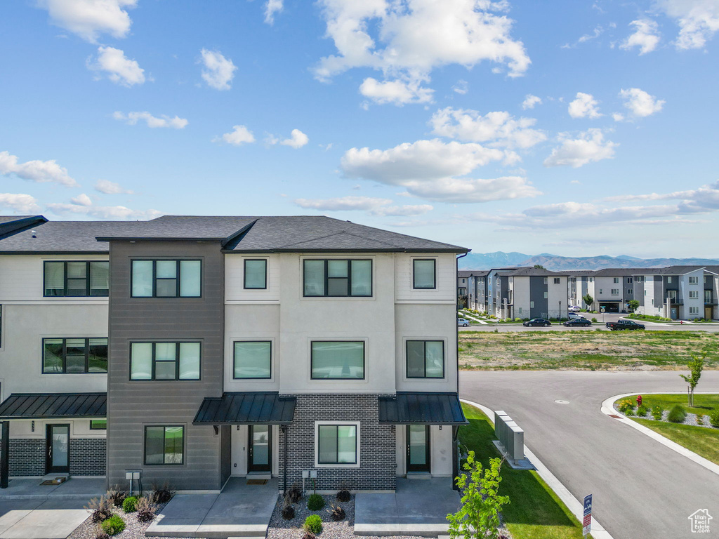 View of property featuring a residential view and a mountain view