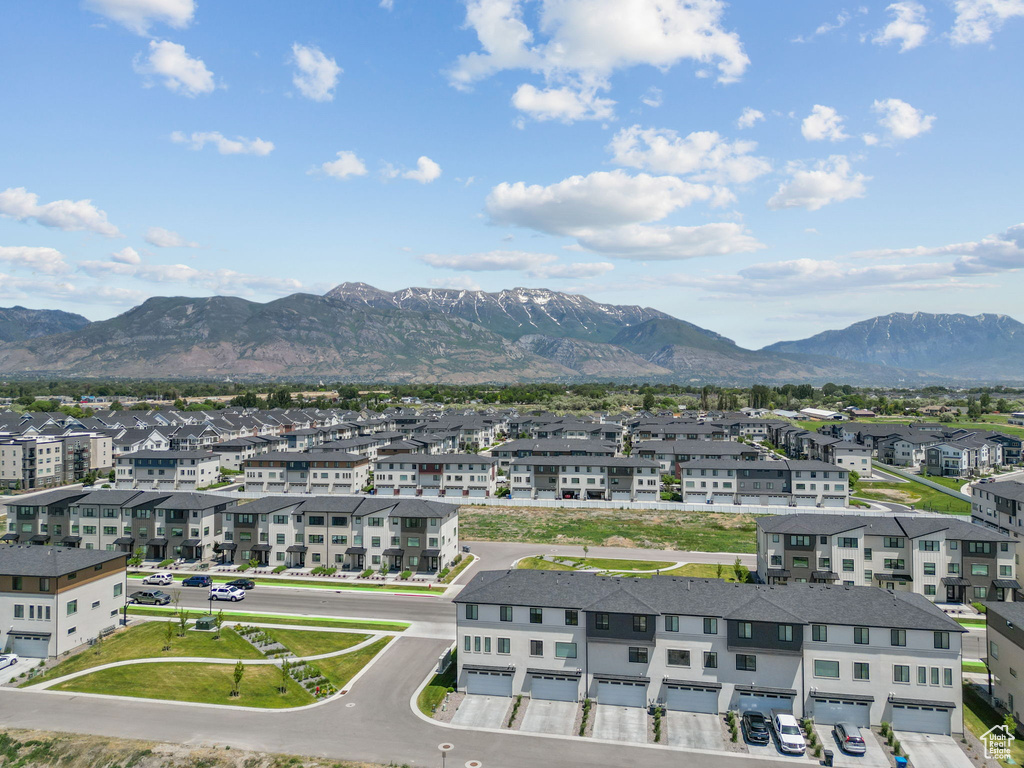 View of mountain backdrop featuring nearby suburban area