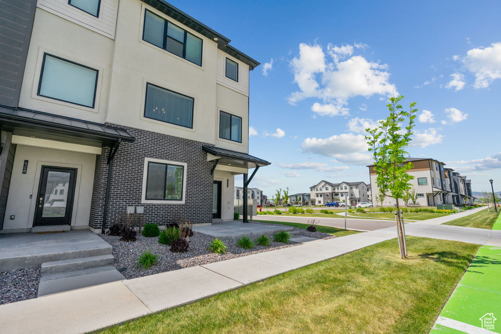View of property with a residential view