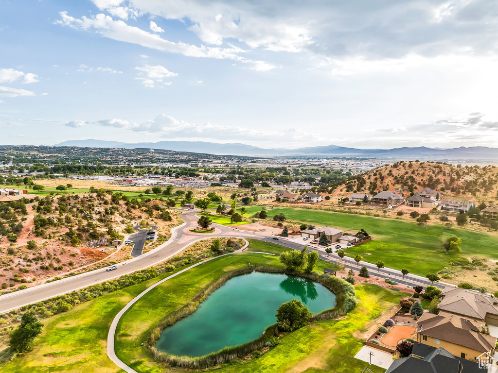 Aerial perspective of suburban area with a water and mountain view
