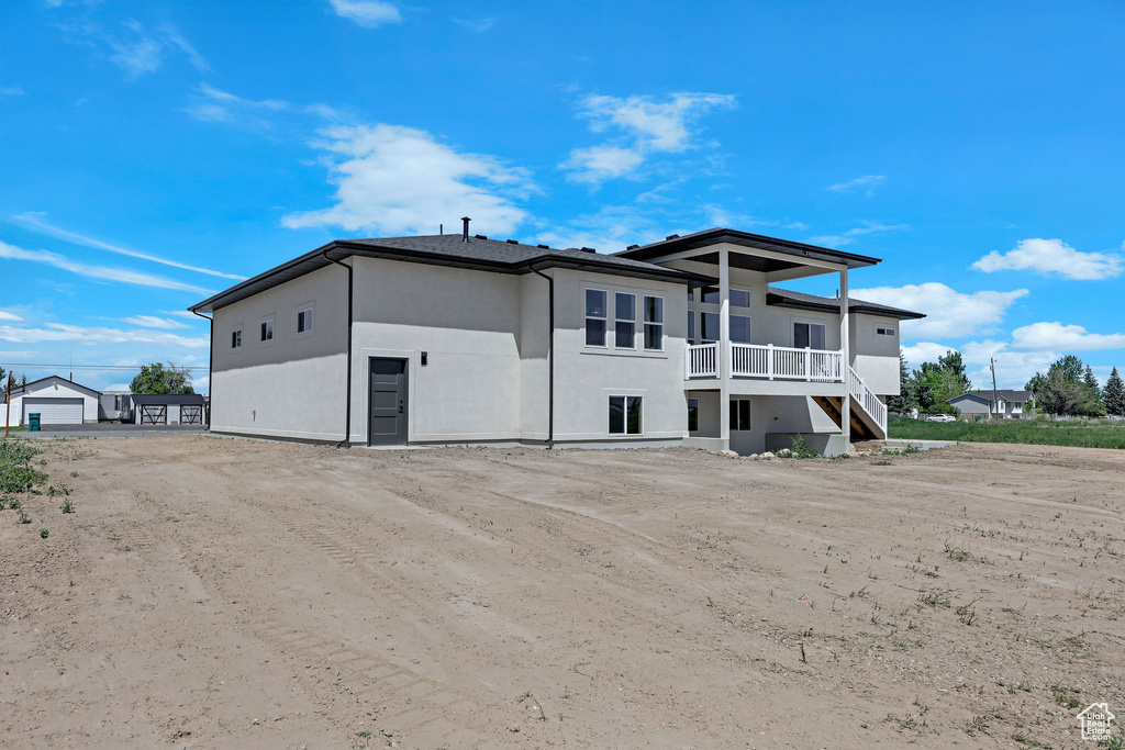 Back of house with stucco siding
