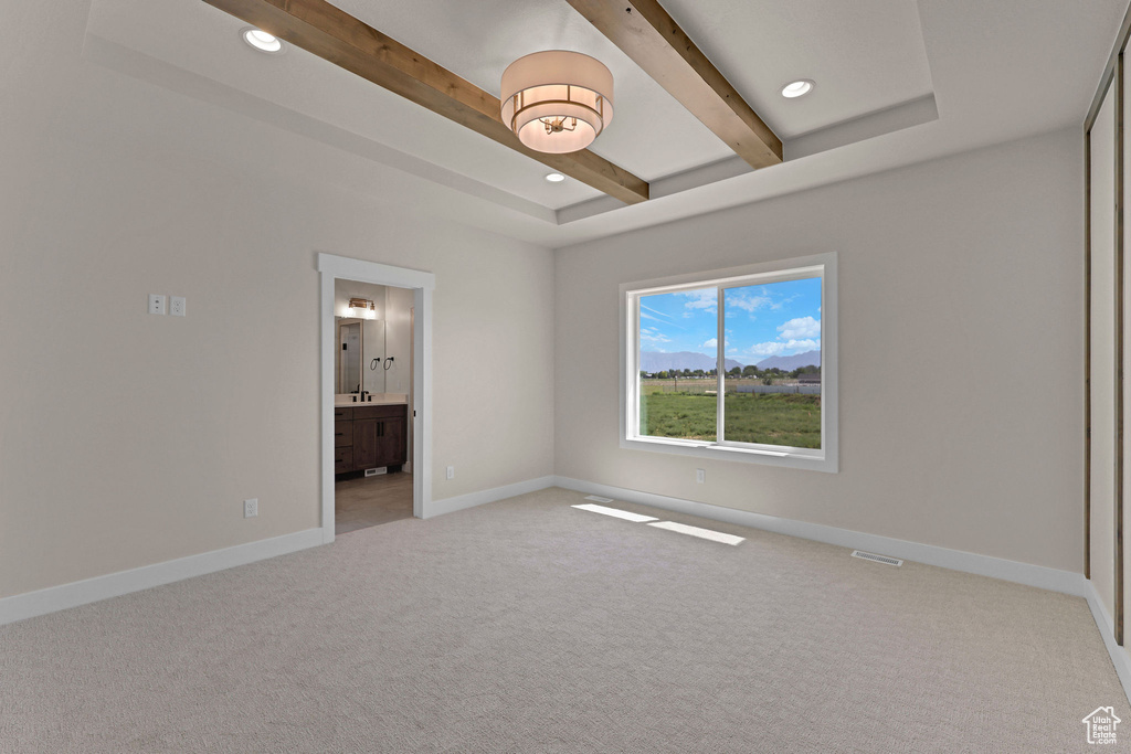 Unfurnished room with beam ceiling, light colored carpet, baseboards, and recessed lighting