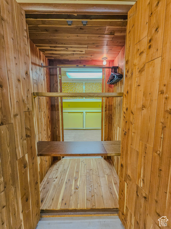 Relaxing sauna / steam room featuring wood walls