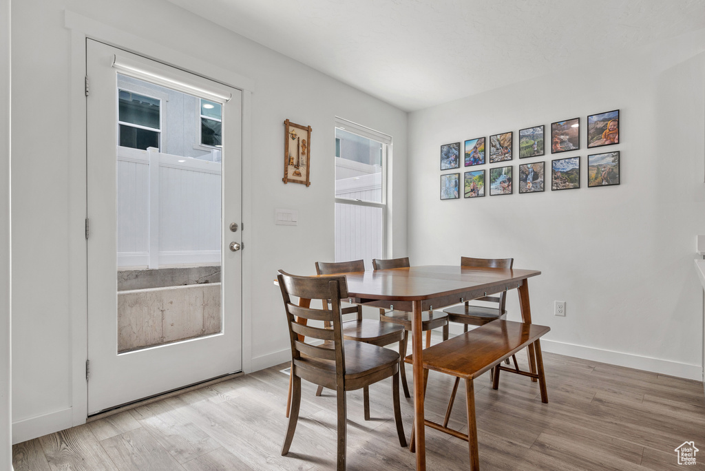 Dining area featuring light wood finished floors and baseboards