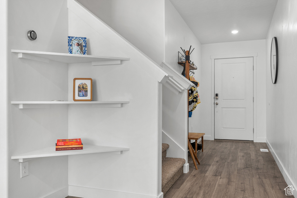 Mudroom featuring wood finished floors, baseboards, and recessed lighting