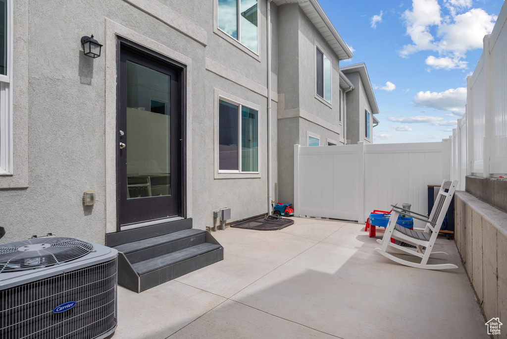 View of patio / terrace featuring entry steps and central AC