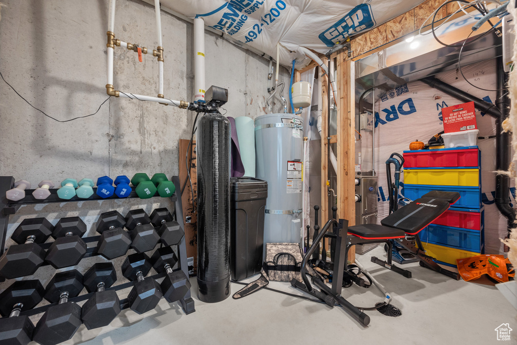 Utility room featuring water heater