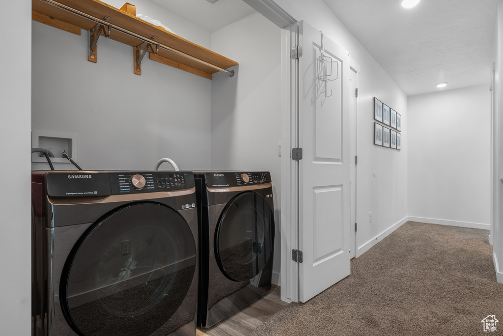 Laundry room featuring washer and dryer, carpet flooring, recessed lighting, and baseboards