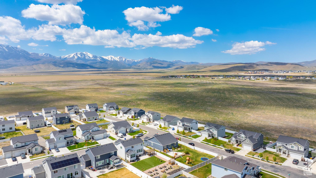 Aerial view of residential area with a mountainous background