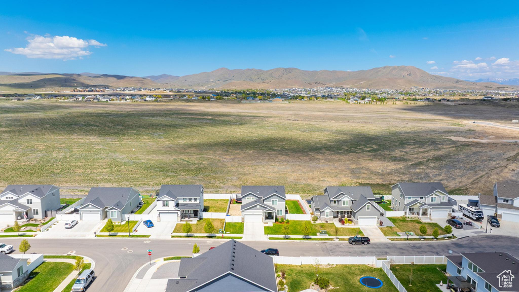 Aerial perspective of suburban area with a mountain backdrop