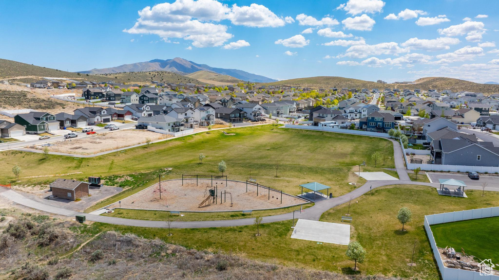 Aerial view of residential area featuring a mountain backdrop