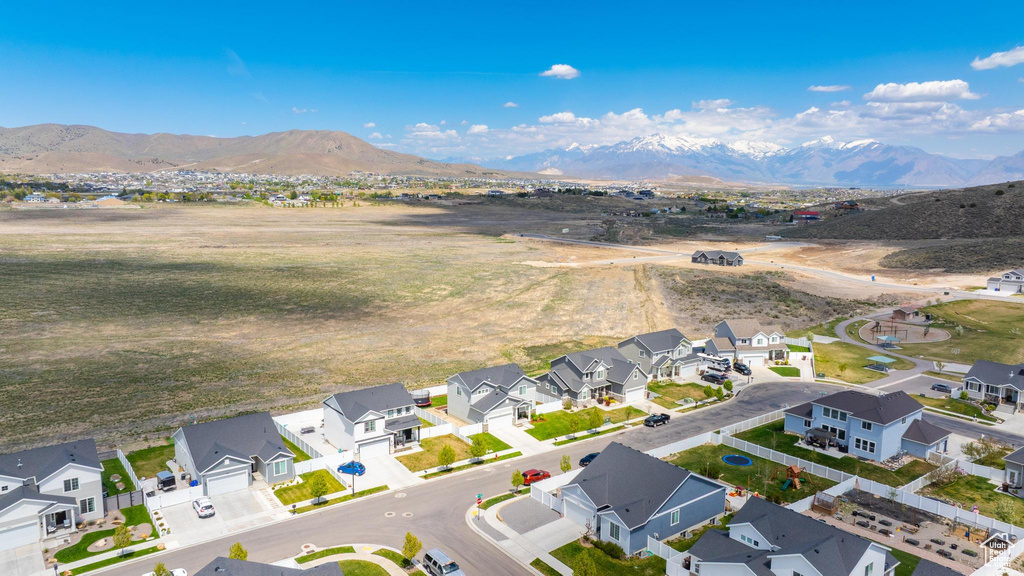 Aerial perspective of suburban area with a mountain backdrop