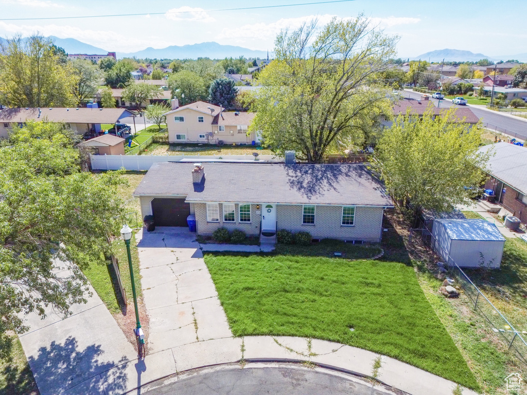 Aerial view of residential area featuring mountains
