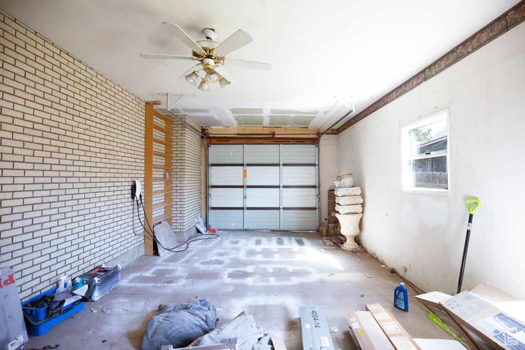 Garage featuring a ceiling fan
