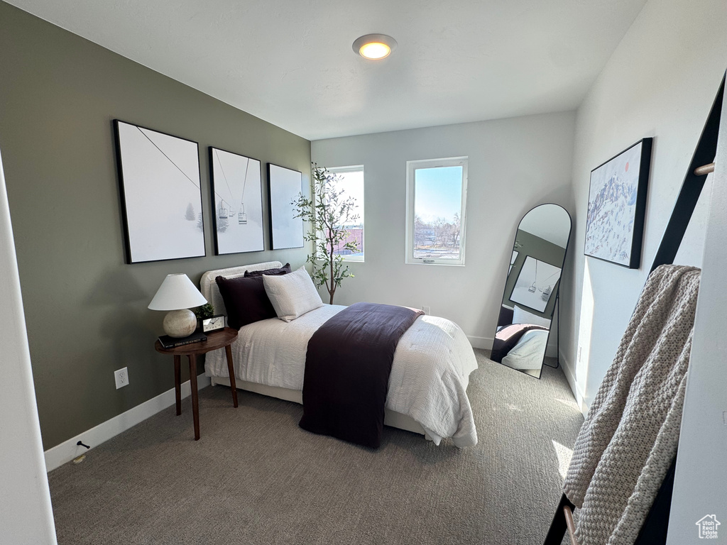 Carpeted bedroom with baseboards